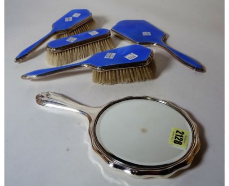 A modern silver mounted and blue enamel dressing table set and a silver plated hand mirror, (5). 