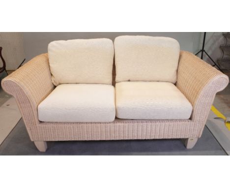 A wicker conservatory suite comprising; a sofa, 170cm wide x 70cm high, and two armchairs, 96cm wide x 71cm high, (3). 