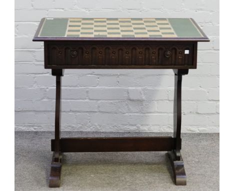 A Tower of London, oak chess table, (lacking chess pieces), 81cm wide x 75cm high x 55cm deep. 