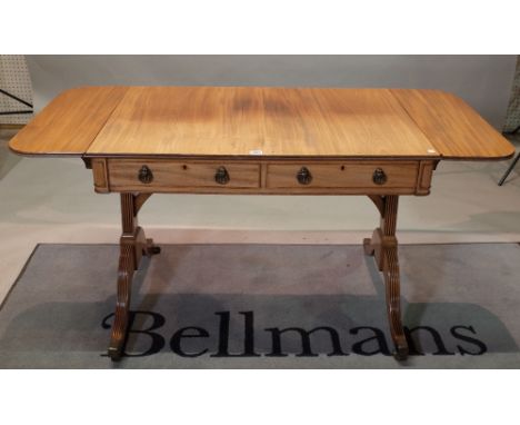 A Regency mahogany sofa table with two frieze drawers on outswept supports, 96cm wide x 71cm high x 66cm deep x 142cm wide wi