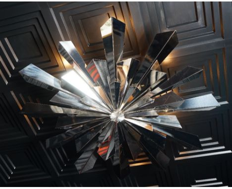 A contemporary chromium starburst light fitting, 120cm diameter. Condition Report This is in good used condition, two of the 