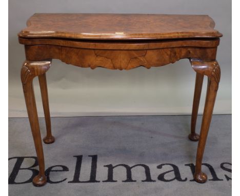 An 18th century style burr walnut demi-lune card table, 94cm wide x 76cm high.  Condition Report Old marks and scratches, spl