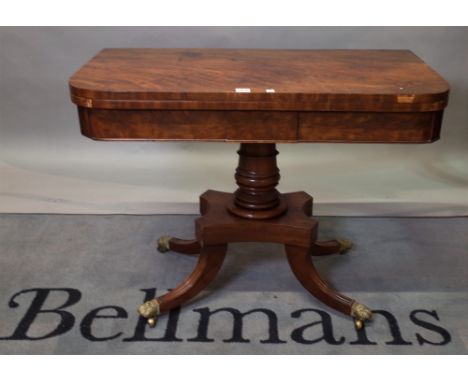 A Regency mahogany D-shaped card table on oval turned column and four downswept supports, 91cm wide x 70cm high. 