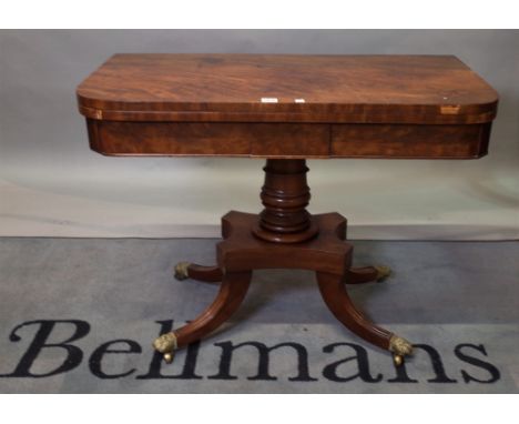 A Regency mahogany D-shaped card table on oval turned column and four downswept supports, 91cm wide x 70cm high. 