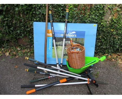 A boxed outdoor garden seat, together with a quantity of garden tools