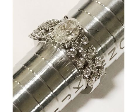 18CT WHITE GOLD DIAMOND RING - 3 ROWS OF SMALL DIAMONDS WITH OVULAR CENTRE STONE