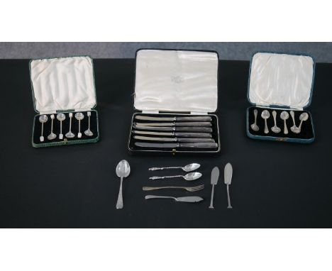 A collection of silver cutlery, including three cased sets of silver cutlery, two sets of coffee spoons one with mother of pe