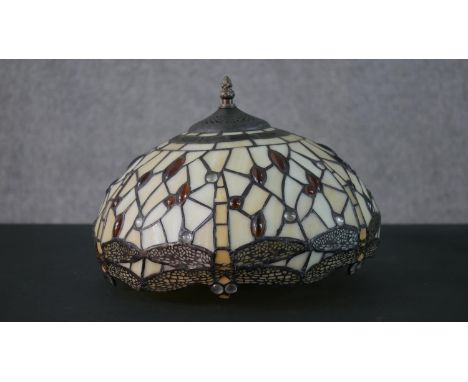 A Tiffany style leaded glass table lamp shade, decorated with dragonflies. H.20 W.31cm 