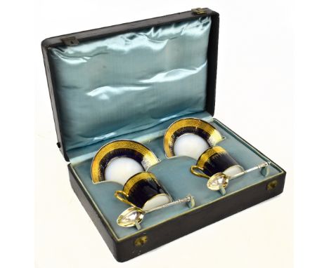 LIMOGES; a pair of coffee cans and saucers, with blue and raised gilt detailing, cased with a pair of white metal spoons, cas