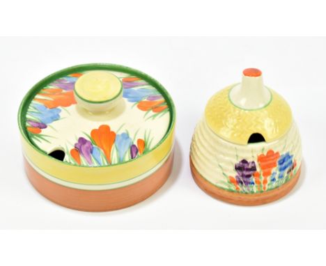 CLARICE CLIFF; a beehive preserve jar decorated in the 'Crocus' pattern, height 8cm,with a circular preserve jar also decorat