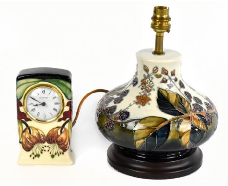 MOORCROFT; a 'Bramble' pattern lamp and an 'Anna Lily' second clock (2).