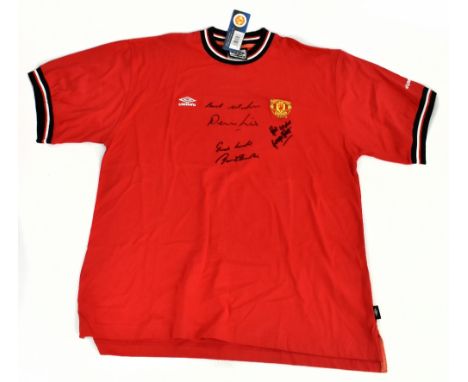 MANCHESTER UNITED; a 2001 T-shirt, signed to the front by George Best, Denis Law and Bobby Charlton, size XL.Additional Infor