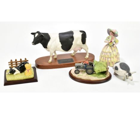 BESWICK; a Connoisseurs model of a Friesian cow on circular wooden plinth base, length 29cm, together with a Border Fine Arts