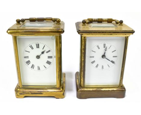 A late 19th century French brass plated carriage clock, the enamel dial set with Roman numerals, height including swing handl