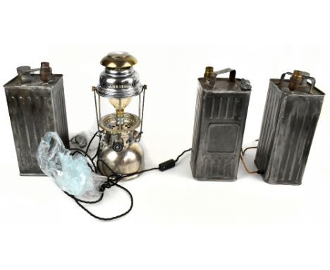 A set of three jerry can lamps, together with a electroplated oil lamp, height of largest 42cm.