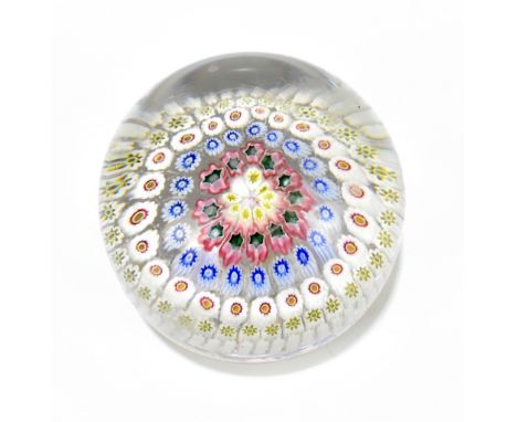 A large domed glass floral decorated paperweight with stepped circular base and rough pontil, diameter 9.5cm.Additional Infor