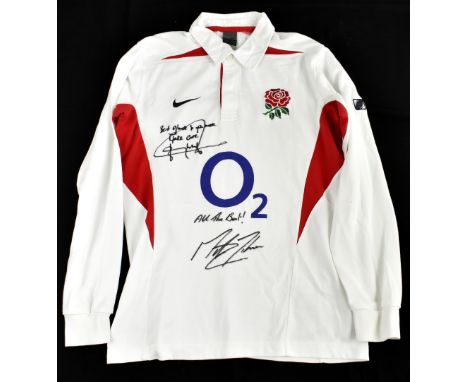 ENGLAND RUGBY; a long sleeved 2003 England rugby shirt, signed to the front by Jonny Wilkinson and Martin Johnson, size M.Add