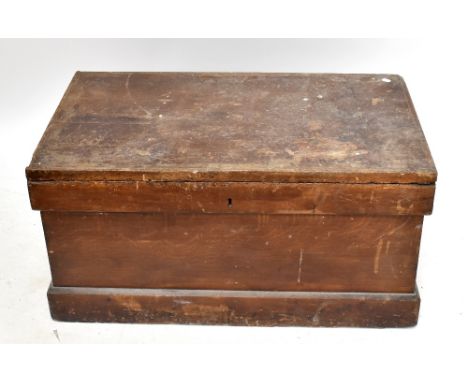 A 19th century stained pine tool chest of rectangular form, on plinth base, width 99cm, depth 58cm (locked and lacking key).