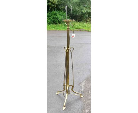 An early 20th century brass rise and fall standard lamp converted to electricity, height 132cm.&nbsp;