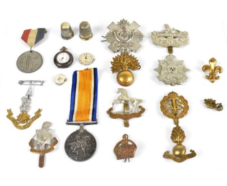 A British WWI War Medal, awarded to 37589.1.A.M J.Woodhall. R.A.F., with various army badges.&nbsp;