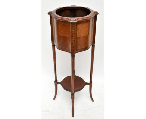 An Edwardian inlaid mahogany jardinière stand with serpentine undertier on outswept legs, height 99cm.Additional InformationG