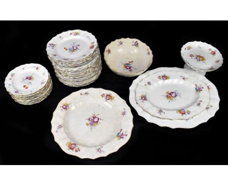 A Continental faience thirty-eight piece part dinner service in the 18th century Meissen style, decorated with floral sprays.