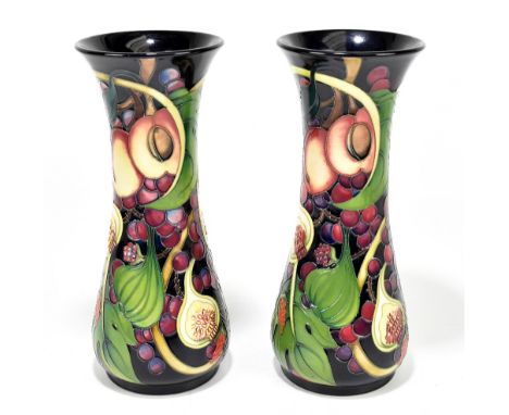 EMMA BOSSONS FOR MOORCROFT; a pair of cylindrical vases decorated in the 'Queens Choice' pattern, height 31cm (2).Additional 