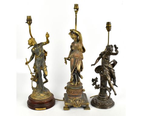 A brass figural table lamp modelled as a maiden standing upon a circular base, height 64cm, with two gilt spelter figural tab