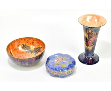 WEDGWOOD; a lustre lidded powder box and cover of shaped circular form, decorated with an exotic bird, printed marks and numb