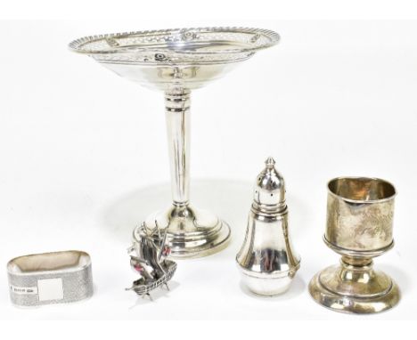 A sterling silver comport with cast and pierced edge on a single tapering stem, height 15cm, with a hallmarked silver match h