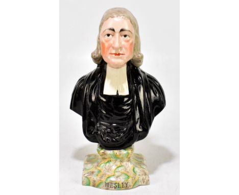 A 19th century Staffordshire bust John Wesley, on painted faux marble base, height 29cm.Additional InformationLight rubbing t