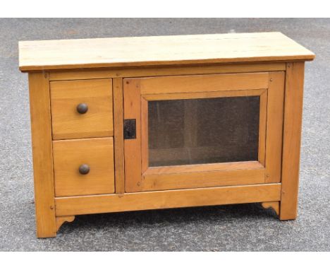 A modern light oak television stand with single glazed door with two drawers on one side, on block legs, width 117cm, depth 4