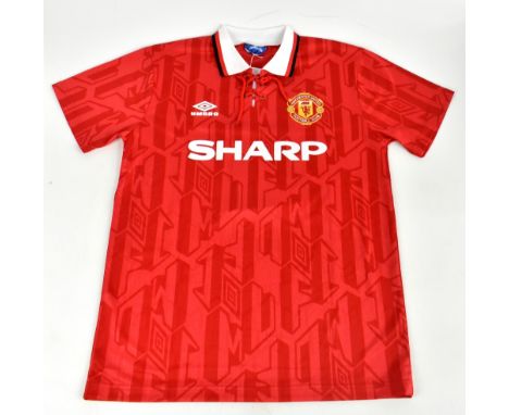 ERIC CANTONA; a 1992/94 Manchester United home shirt, signed to the reverse, size M.Additional InformationCreasing and light 