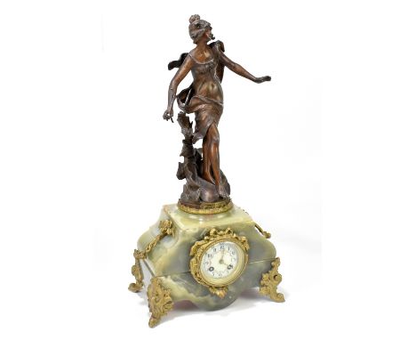 A late 19th century onyx and spelter figural mantel clock, the case surmounted by a figure, 'Nymph de L'Onde', after Moreau, 