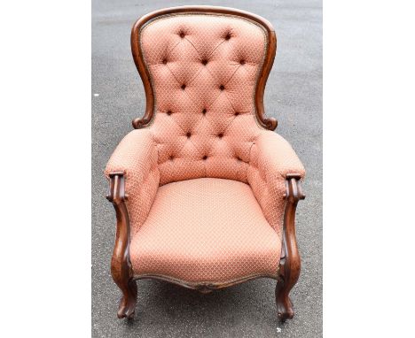 A Victorian mahogany salon chair, with upholstered button back, on scroll legs, height 102cm. 