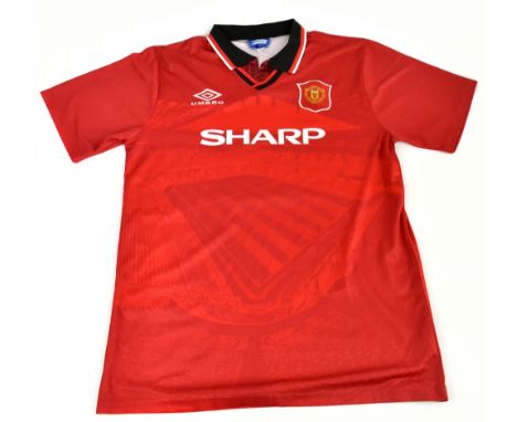 ERIC CANTONA; a Manchester United 1994/96 home shirt, signed to the reverse, size unknown.Additional InformationCreasing and 