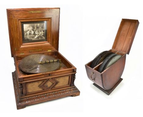 A 19th century carved and burr walnut cased polyphon music box, the hinged cover with&nbsp;marquetry inlaid decoration, the i