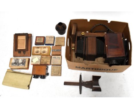 An Edwardian magic lantern, with an assortment of magic lantern slides, two stereoscopic viewers, and a small selection of&nb