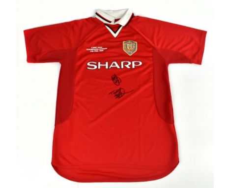 MANCHESTER UNITED; a 1999 Camp Nou retro style shirt, signed to the front by Solskjaer and Sheringham, size L.Additional Info