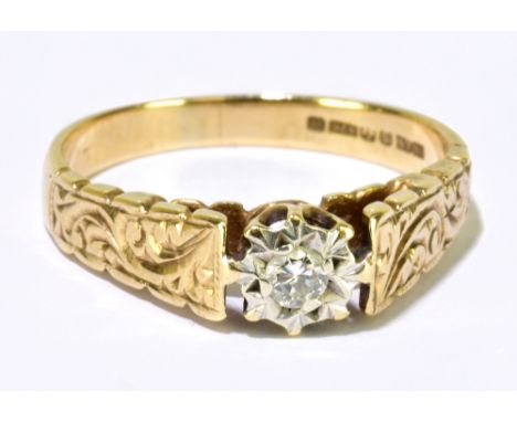 A 9ct yellow gold tiny diamond illusion set solitaire ring, with scroll decoration to the shoulders, ring size M, approx. 2.8