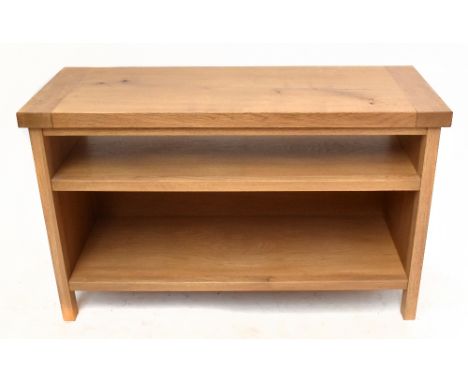 A reproduction light oak television stand, height 56cm, width 93cm, depth 37cm.&nbsp;