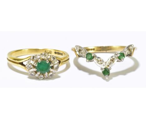 Two 9ct yellow gold emerald and diamond dress rings, the wishbone example size M, the oval example size L, combined weight ap