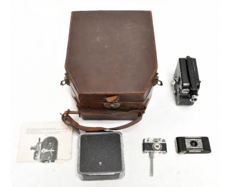 A Pathescope "H" Camera, with a cased Cine Nizo 16 Mod.D3, with a further camera, an Ensign Midget, model no.22, and a photo-