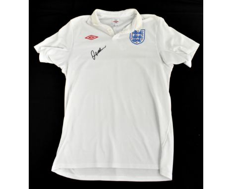 DAVID BECKHAM; a 2010 England football shirt, signed to the front, size L.Additional InformationCreasing and light general we