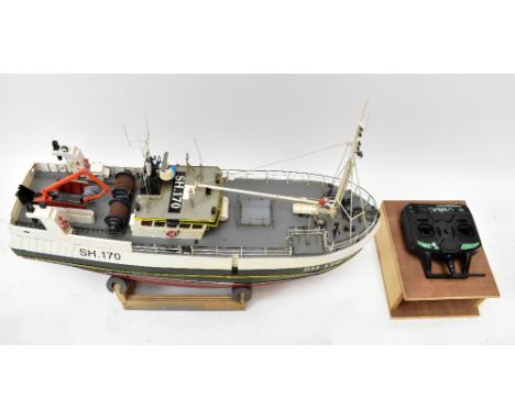 A scratch-built radio controlled model fishing trawler 'Maggie M, SH.170', length 85cm, complete with remote control.Addition