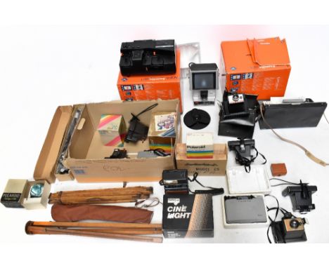 An assortment of vintage camera equipment to include two Agfa family sets, an assortment of Polaroid cameras and accessories,