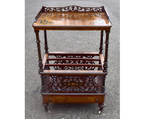 A Victorian walnut Canterbury/whatnot on four turned columns, three division music section, pierced front, sides, and back, w
