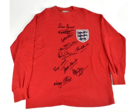 ENGLAND; a 1966 retro style long sleeve shirt, signed to the front by Peters, Hurst, J. Charlton, Wilson, Stiles, Hunt, Banks