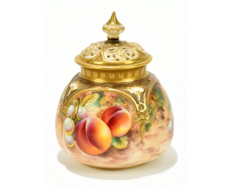 T HOLLAND FOR ROYAL WORCESTER; a hand painted potpourri and cover decorated with fruit in panels, with pierced cover, height 