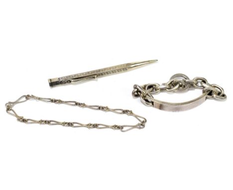 A sterling silver chain linked identity bracelet, presentation inscription to the underside, with a white metal fancy link br